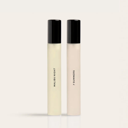 Two rectangular fragrance bottles with black caps, one containing pale yellow liquid labeled "Malibu Night" and one with beig