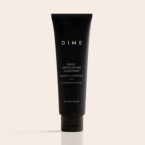 Black tube of DIME Daily Exfoliating Cleanser, 4 fl oz, with white text labeling on neutral background.