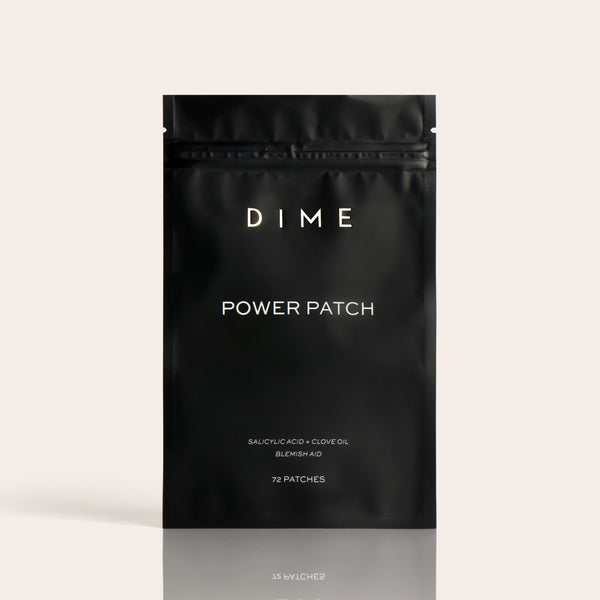 Black pouch labeled "DIME Power Patch" containing 72 patches with salicylic acid and clove oil for blemish aid.