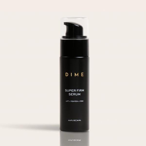 Black cylindrical pump bottle labeled "DIME Super Firm Serum" with clear top cap, 0.5 FL OZ size.