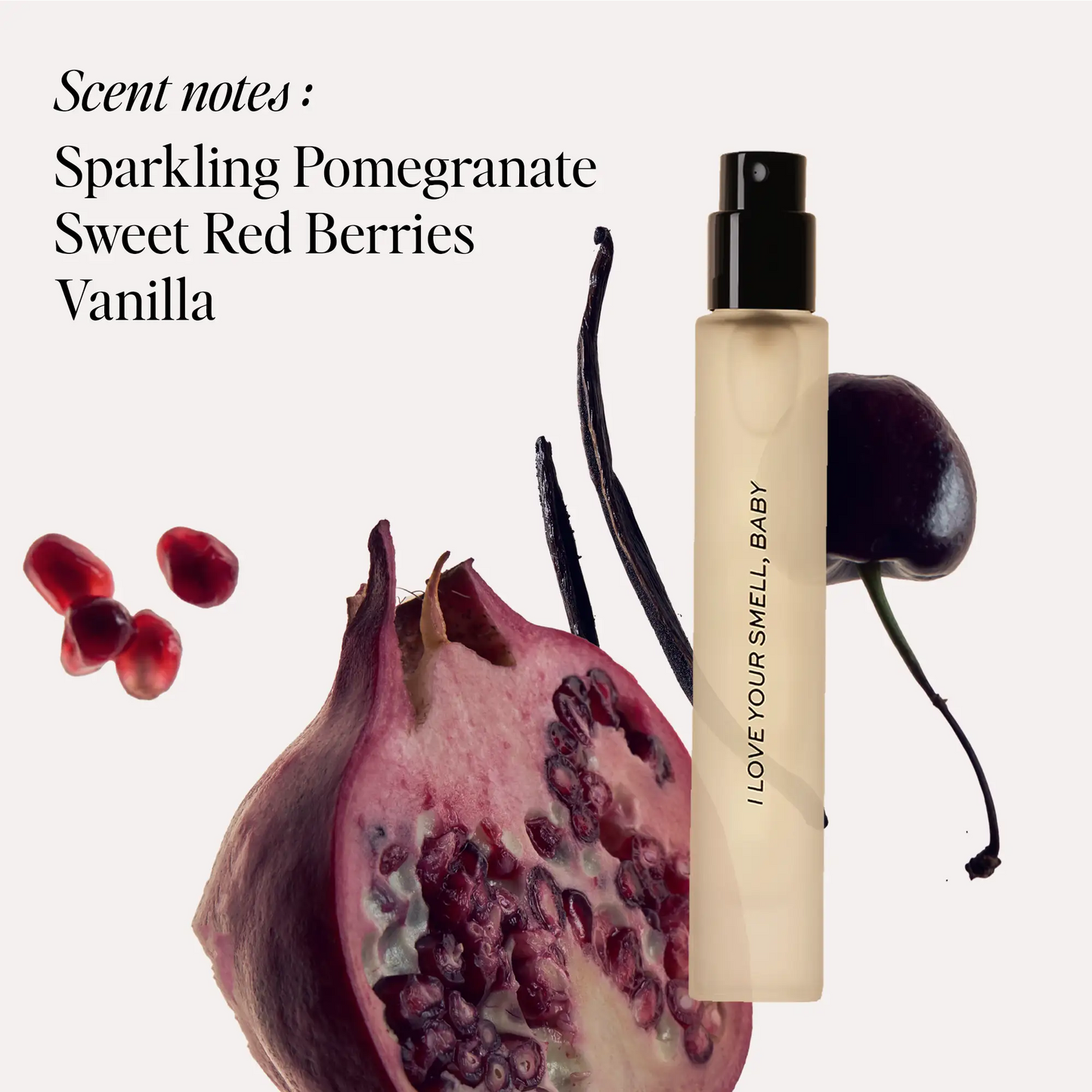 Rectangular cream-colored travel spray bottle with black sprayer and "I Love Your Smell, Baby" text, surrounded by pomegranat
